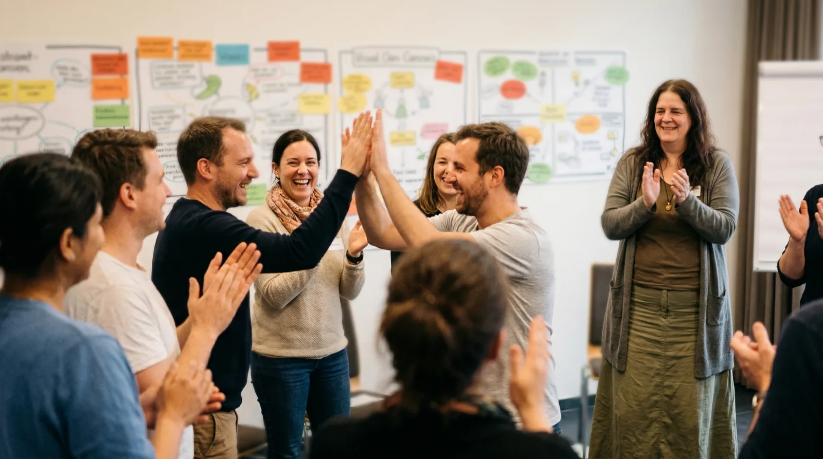 Workshop participants celebrating a breakthrough moment